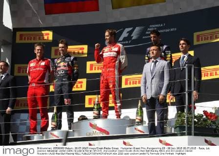 Hungarian Grand Prix, Hungaroring 23 - 26 July 2015 26.07.2015 - Race, 1st position Sebastian Vettel (GER) Scuderia Ferrari SF15-T, 2nd position Daniil Kvyat (RUS) Red Bull Racing RB11 and 3rd position Daniel Ricciardo (AUS) Red Bull Racing RB11 