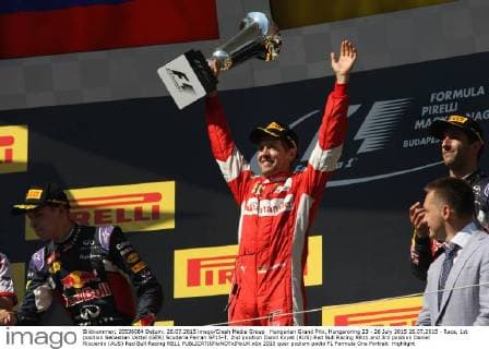 Hungarian Grand Prix, Hungaroring 23 - 26 July 2015 26.07.2015 - Race, 1st position Sebastian Vettel (GER) Scuderia Ferrari SF15-T, 2nd position Daniil Kvyat (RUS) Red Bull Racing RB11 and 3rd position Daniel Ricciardo (AUS) Red Bull Racing RB11 