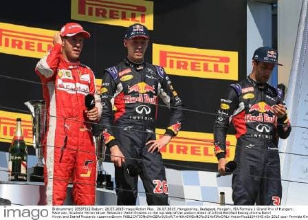 26.07.2015. Hungaroring, Budapest, Hungary. FIA Formula 1 Grand Prix of Hungary. Race day. Scuderia Ferrari driver Sebastian Vettel finishes on the top step of the podium ahead of Infiniti Red Bull Racing drivers Daniil Kvyat and Daniel Ricciardo xLeannexBoonx  ActionPlus11644045