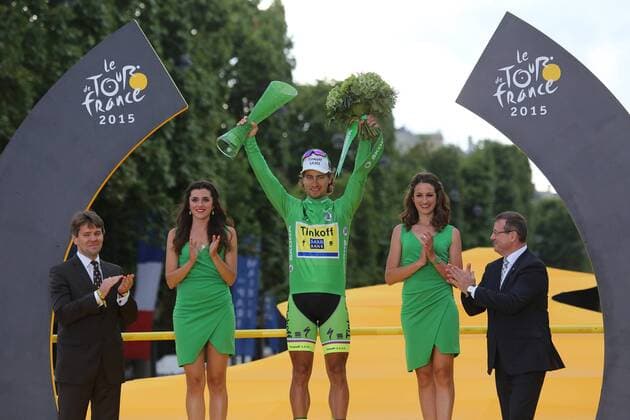 Peter Sagan of Slovakia celebrates on the presentation podium after winning the green jersey (overall points leader) at the Tour de France in Paris on July 26, 2015. Chris Froome of Great Britain claimed his second Tour de France victory, becoming the first Briton to do so.  PAR20150726706 DAVIDxSILPA