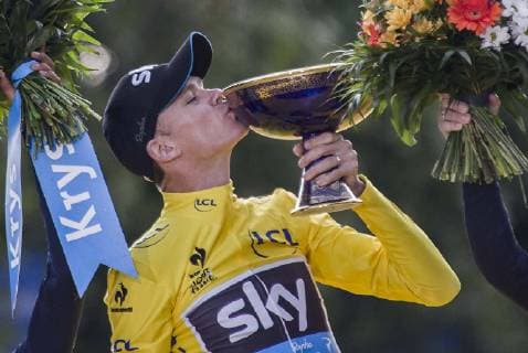 (150727) -- PARIS, July 27, 2015 -- Team Sky rider Chris Froome of Britain kisses his champion trophy during the awarding ceremony for Tour de France cycling race 2015 in Paris, France, July 26, 2015. Chris Froome claimed the title of the event with a overall time of 84 hours, 46 minutes and 16 seconds. ) (SP)FRANCE-PARIS-CYCLING-TOUR DE FRANCE ChenxXiaowei 
