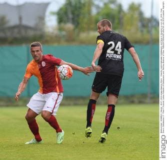 Friendly match between Galatasaray and Nice in Slovenia on July 28, 2015. Final Score: Galatasaray 0 - Nice 4 Pictured: Lukas Podolski of Galatasaray and Mathieu Bodmer of Nice. 