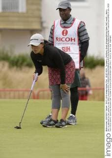 30.07.2015. Turnberry, Scotland. Ricoh Womens British Open Golf round 1. Jenny Suh is watched by her caddy on the 18th xLorrainexHillx  ActionPlus11645110