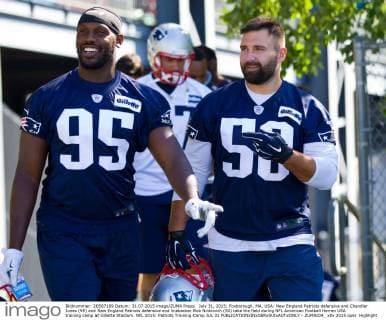 July 31, 2015; Foxborough, MA, USA: New England Patriots defensive end Chandler Jones (95) and New England Patriots defensive end linebacker Rob Ninkovich (50) take the field during NFL American Football Herren USA training camp at Gillette Stadium. NFL 2015: Patriots Training Camp JUL 31 - ZUMAc04_