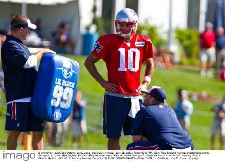 July 31, 2015; Foxborough, MA, USA: New England Patriots quarterback Jimmy Garoppolo (10) and New England Patriots offensive coordinator Josh McDaniels during NFL American Football Herren USA training camp at Gillette Stadium. NFL 2015: Patriots Training Camp JUL 31 - ZUMAc04_