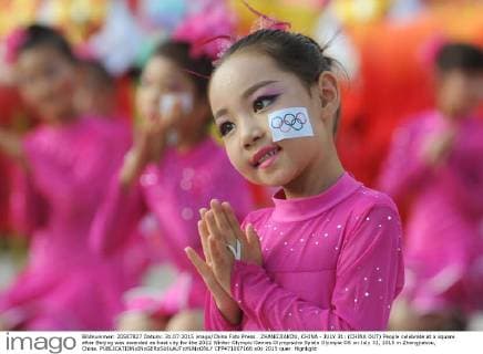 ZHANGJIAKOU, CHINA - JULY 31: (CHINA OUT) People celebrate at a square after Beijing was awarded as host city for the 2022 Winter Olympic Games Olympische Spiele Olympia OS on July 31, 2015 in Zhangjiakou, China.  CFP471007166 