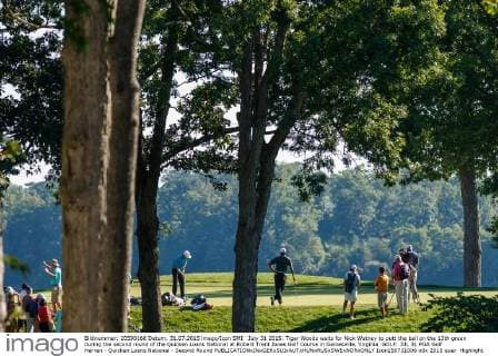 July 31 2015: Tiger Woods waits for Nick Watney to putt the ball on the 13th green during the second round of the Quicken Loans National at Robert Trent Jones Golf Course in Gainesville, Virginia. GOLF: JUL 31 PGA Golf Herren - Quicken Loans National - Second Round Icon150731006 EDITORIAL USE ONLY
