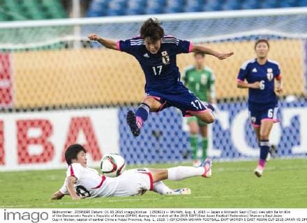 (150801) -- WUHAN, Aug. 1, 2015 -- Japan s Arimachi Saori (Top) vies with Ra Un Kim of the Democratic People s Republic of Korea (DPRK) during their match at the 2015 EAFF(East Asian Football Federation) Women s East Asian Cup in Wuhan, capital of central China s Hubei Province, Aug. 1, 2015. ) (SP)CHINA-WUHAN-FOOTBALL-EAFF WOMEN S EAST ASIAN CUP 2015-JAPAN VS DPRK XiaoxYijiu 