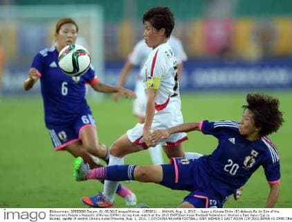 (150801) -- WUHAN, Aug. 1, 2015 -- Japan s Kohata Shiho (R) defends Ra Un Sim of the Democratic People s Republic of Korea (DPRK) during their match at the 2015 EAFF(East Asian Football Federation) Women s East Asian Cup in Wuhan, capital of central China s Hubei Province, Aug. 1, 2015. ) (SP)CHINA-WUHAN-FOOTBALL-EAFF WOMEN S EAST ASIAN CUP 2015-JAPAN VS DPRK ChengxMin 