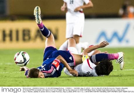 (150801) -- WUHAN, Aug. 1, 2015 -- Ra Un Sim (R) of the Democratic People s Republic of Korea (DPRK) competes with Kawamura Yuri of Japan during the match at the 2015 EAFF(East Asian Football Federation) Women s East Asian Cup in Wuhan, capital of central China s Hubei Province, Aug. 1, 2015. DPRK won 4-2. ) (SP)CHINA-WUHAN-FOOTBALL-EAFF WOMEN S EAST ASIAN CUP 2015-JAPAN VS DPRK XiaoxYijiu 