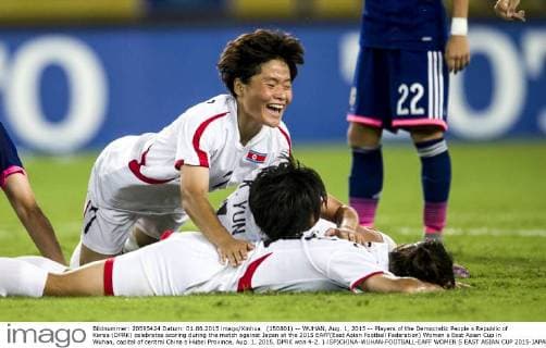 (150801) -- WUHAN, Aug. 1, 2015 -- Players of the Democratic People s Republic of Korea (DPRK) celebrates scoring during the match against Japan at the 2015 EAFF(East Asian Football Federation) Women s East Asian Cup in Wuhan, capital of central China s Hubei Province, Aug. 1, 2015. DPRK won 4-2. ) (SP)CHINA-WUHAN-FOOTBALL-EAFF WOMEN S EAST ASIAN CUP 2015-JAPAN VS DPRK XiaoxYijiu 