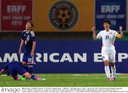 (150801) -- WUHAN, Aug. 1, 2015 -- Ra Un Sim (R) of the Democratic People s Republic of Korea (DPRK) celebrates victory after the match against Japan at the 2015 EAFF(East Asian Football Federation) Women s East Asian Cup in Wuhan, capital of central China s Hubei Province, Aug. 1, 2015. DPRK won 4-2. ) (SP)CHINA-WUHAN-FOOTBALL-EAFF WOMEN S EAST ASIAN CUP 2015-JAPAN VS DPRK ChengxMin 
