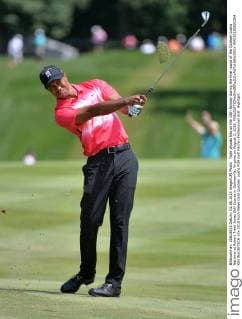Tiger Woods hits on the 18th fairway during the final round of the Quicken Loans National at Robert Trent Jones Golf Course in Gainesville, Virginia on August 2, 2015.  WAP20150802304 KEVINxDIETSCH