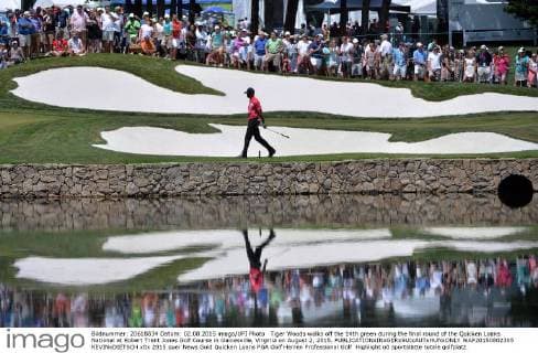 Tiger Woods walks off the 14th green during the final round of the Quicken Loans National at Robert Trent Jones Golf Course in Gainesville, Virginia on August 2, 2015.  WAP20150802305 KEVINxDIETSCH