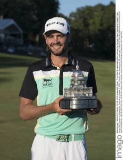 Troy Merritt celebrates after winning the Quicken Loans National at Robert Trent Jones Golf Course in Gainesville, Virginia on August 2, 2015. Merritt won shooting an 18-under-par.  WAP20150802311 KEVINxDIETSCH