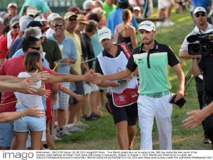 Troy Merritt greets fans as he walks to the 18th tee during the final round of the Quicken Loans National at Robert Trent Jones Golf Course in Gainesville, Virginia on August 2, 2015. Merritt won shooting an 18-under-par.  WAP20150802318 KEVINxDIETSCH