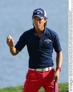 Ishikawa finishes 10th at Quicken Loans National Ryo Ishikawa of Japan acknowledges the gallery after completing the final round of the Quicken Loans National at Robert Trent Jones Golf Club in Gainesville, Virginia, on Aug. 2, 2015. Ishikawa could only manage an even-par 71 and settled for 10th place. 