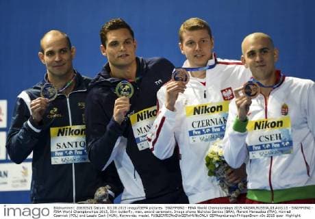 SWIMMING - FINA World Championships 2015 KAZAN,RUSSIA,03.AUG.15 - SWIMMING - FINA World Championships 2015, 50m butterfly, men, award ceremony. Image shows Nicholas Santos (BRA), Florent Manaudou (FRA), Konrad Czerniak (POL) and Laszlo Cseh (HUN). Keywords: medal. GEPAxpictures xPhilippxBrem