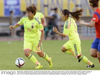 Japan play South Korea in women s East Asian Cup Mina Tanaka of Japan (L) controls the ball during the first half of a match against South Korea in the women s tournament at the East Asian cup in Wuhan, China, on Aug. 4, 2015. 