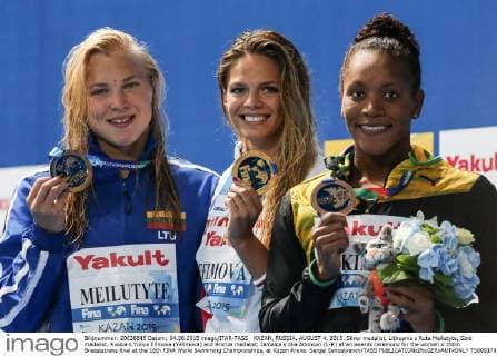 KAZAN, RUSSIA. AUGUST 4, 2015. Silver medalist, Lithuania s Ruta Meilutyte, Gold medalist, Russia s Yuliya Efimova (Yefimova) and Bronze medalist, Jamaica s Alia Atkinson (L-R) at an awards ceremony for the women s 100m Breaststroke final at the 16th FINA World Swimming Championships, at Kazan Arena. Sergei Savostyanov TASS  TS009178