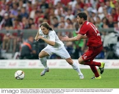 Bayern Munich s Xabi Alonso tussles with Real Madrid s Luka Modric Audi Cup 2015 - Bayern Munich vs Real Madrid - Allianz Arena- Munich -Germany - 5th August 2015 - Picture David Klein Sportimage EDITORIAL USE ONLY. No use with unauthorised audio, video, data, fixture lists, club league logos or live services. Online in-match use limited to 120 images, no video emulation. No use in betting, games or single club league player publications.