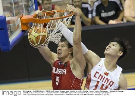 August 4, 2015. - Russia, Moscow region, Novogorsk. - Basketball. Russia - China friendly match. In picture: Russian national basketball team player Ruslan Pateev (5, in red). PhotoagencyxInterpress 