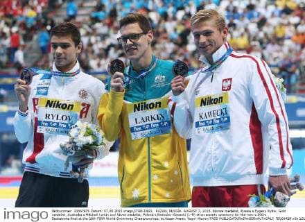 KAZAN, RUSSIA. AUGUST 7, 2015. Bronze medalist, Russia s Evgeny Rylov, Gold medalist, Australia s Mitchell Larkin and Silver medalist, Poland s Radoslav Kawecki (L-R) at an awards ceremony for the men s 200m Backstroke final at the 16th FINA World Swimming Championships, at Kazan Arena. Yegor Aleyev TASS  TS0094B8