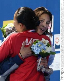 KAZAN, RUSSIA. AUGUST 7, 2015. Gold medalist, Japan s Kanako Watanabe (L) and Silver medalist, US Micah Lawrence hug each other at an awards ceremony for the women s 200m Breaststroke final at the 16th FINA World Swimming Championships, at Kazan Arena. Valery Sharifulin TASS  TS0094F7