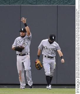 Aug. 7, 2015 - Kansas City, MO, USA - Chicago White Sox left fielder Melky Cabrera (53) signals for a trainer for center fielder Adam Eaton (1) after Eaton was injured catching a fly ball by the Kansas City Royals Ben Zobrist in the fourth inning at Kauffman Stadium in Kansas City, Mo., on Friday, Aug. 7, 2015. Eaton left the game. Chicago White Sox at Kansas City Royals - ZUMAm67_