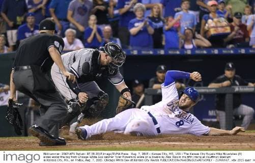 Aug. 7, 2015 - Kansas City, MO, USA - The Kansas City Royals Mike Moustakas (8) slides under the tag from Chicago White Sox catcher Tyler Flowers to score on a double by Alex Rios in the fifth inning at Kauffman Stadium in Kansas City, Mo., on Friday, Aug. 7, 2015. Chicago White Sox at Kansas City Royals - ZUMAm67_