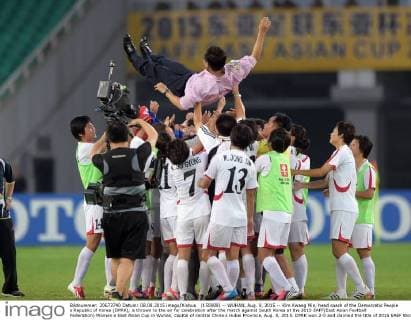 (150808) -- WUHAN, Aug. 8, 2015 -- Kim Kwang Min, head coach of the Democratic People s Republic of Korea (DPRK), is thrown to the air for celebration after the match against South Korea at the 2015 EAFF(East Asian Football Federation) Women s East Asian Cup in Wuhan, capital of central China s Hubei Province, Aug. 8, 2015. DPRK won 2-0 and claimed the title of 2015 EAEF Women s East Asian Cup. ) (SP)CHINA-WUHAN-FOOTBALL-EAFF EAST ASIAN CUP 2015-WOMEN-CHAMPIONSHIP ChengxMin 