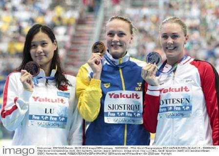SWIMMING - FINA World Championships 2015 KAZAN,RUSSIA,08.AUG.15 - SWIMMING - FINA World Championships 2015, 50m butterfly, women, award ceremony. Image shows Ying Lu (CHN), Sarah Sjostrom (SWE) and Jeanette Ottesen (DEN). Keywords: medal. GEPAxpictures xPhilippxBrem