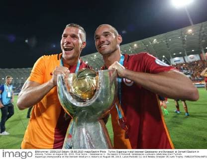 Turkey Supercup match between Galatasaray and Bursaspor at Osmanli Stadium in Ankara, Turkey on August 08, 2015. Final Score : Galatasaray 1 - Bursaspor 0 Pictured: Galatasaray s players celebrates their Turkish SuperCup championship at the Osmanli Stadium in Ankara on August 08, 2015. Lukas Podolski (L) and Wesley Sneijder (R) with Trophy. 