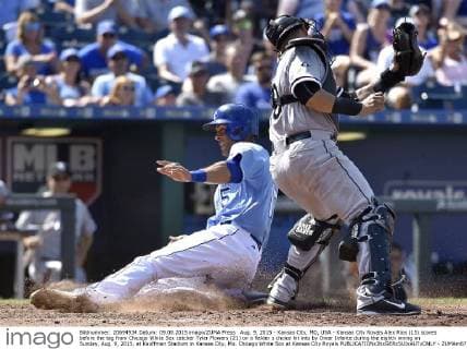 Aug. 9, 2015 - Kansas City, MO, USA - Kansas City Royals Alex Rios (15) scores before the tag from Chicago White Sox catcher Tyler Flowers (21) on a fielder s choice hit into by Omar Infante during the eighth inning on Sunday, Aug. 9, 2015, at Kauffman Stadium in Kansas City, Mo. Chicago White Sox at Kansas City Royals - ZUMAm67_