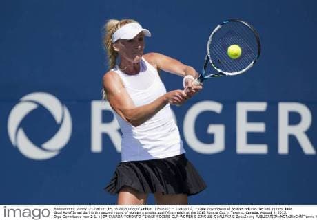 (150810) -- TORONTO, - Olga Govortsova of Belarus returns the ball against Julia Glushko of Israel during the second round of women s singles qualifying match at the 2015 Rogers Cup in Toronto, Canada, August 9, 2015. Olga Govortsova won 2-1. ) (SP)CANADA-TORONTO-TENNIS-ROGERS CUP-WOMEN S SINGLES-QUALIFYING ZouxZheng 