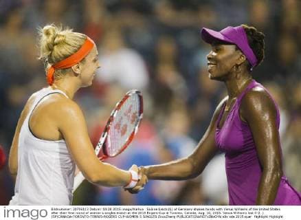 Sabine Lisicki(L) of Germany shakes hands with Venus Williams of the United States after their first round of women s singles match at the 2015 Rogers Cup in Toronto, Canada, Aug. 10, 2015. Venus Williams lost 0-2. ) (SP)CANADA-TORONTO-TENNIS-ROGERS CUP-WOMEN S SINGLES ZouxZheng 