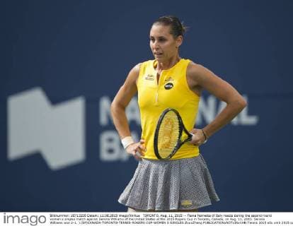 TORONTO, Aug. 11, 2015 -- Flavia Pennetta of Italy reacts during the second round women s singles match against Serena Williams of the United States at the 2015 Rogers Cup in Toronto, Canada, on Aug. 11, 2015. Serena Williams won 2-1. ) (SP)CANADA-TORONTO-TENNIS-ROGERS CUP-WOMEN S SINGLES ZouxZheng 