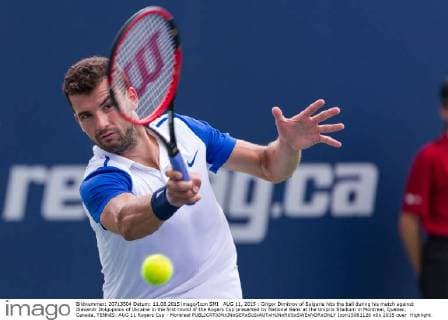 AUG 11, 2015 : Grigor Dimitrov of Bulgaria hits the ball during his match against Alexandr Dolgopolov of Ukraine in the first round of the Rogers Cup presented by National Bank at the Uniprix Stadium in Montreal, Quebec, Canada. TENNIS: AUG 11 Rogers Cup - Montreal Icon15081126 EDITORIAL USE ONLY