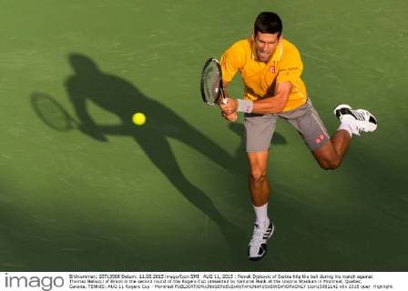 AUG 11, 2015 : Novak Djokovic of Serbia hits the ball during his match against Thomaz Bellucci of Brazil in the second round of the Rogers Cup presented by National Bank at the Uniprix Stadium in Montreal, Quebec, Canada. TENNIS: AUG 11 Rogers Cup - Montreal Icon15081142 EDITORIAL USE ONLY