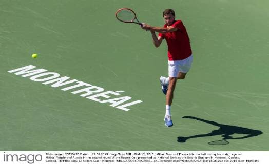 AUG 12, 2015 : Gilles Simon of France hits the ball during his match against Mikhail Youzhny of Russia in the second round of the Rogers Cup presented by National Bank at the Uniprix Stadium in Montreal, Quebec, Canada. TENNIS: AUG 12 Rogers Cup - Montreal Icon15081203 EDITORIAL USE ONLY