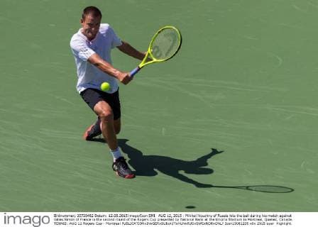 AUG 12, 2015 : Mikhail Youzhny of Russia hits the ball during his match against Gilles Simon of France in the second round of the Rogers Cup presented by National Bank at the Uniprix Stadium in Montreal, Quebec, Canada. TENNIS: AUG 12 Rogers Cup - Montreal Icon15081205 EDITORIAL USE ONLY