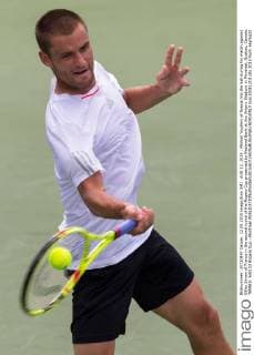 AUG 12, 2015 : Mikhail Youzhny of Russia hits the ball during his match against Gilles Simon of France in the second round of the Rogers Cup presented by National Bank at the Uniprix Stadium in Montreal, Quebec, Canada. TENNIS: AUG 12 Rogers Cup - Montreal Icon15081213 EDITORIAL USE ONLY