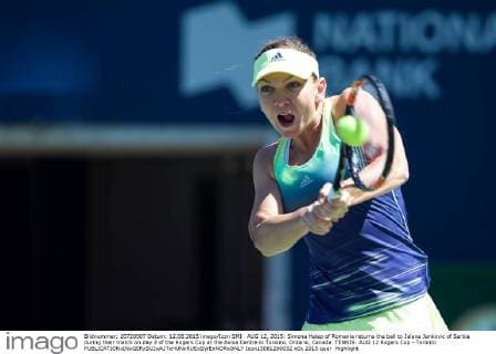 AUG 12, 2015: Simona Halep of Romania returns the ball to Jelena Jankovic of Serbia during their match on day 3 of the Rogers Cup at the Aviva Centre in Toronto, Ontario, Canada. TENNIS: AUG 12 Rogers Cup - Toronto Icon15081280032 EDITORIAL USE ONLY