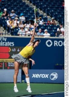 AUG 12, 2015: Caroline Wozniacki of Denmark serves the ball to Belinda Bencic of Switzerland during their match on day 3 of the Rogers Cup at the Aviva Centre in Toronto, Ontario, Canada. TENNIS: AUG 12 Rogers Cup - Toronto Icon150812123733 EDITORIAL USE ONLY