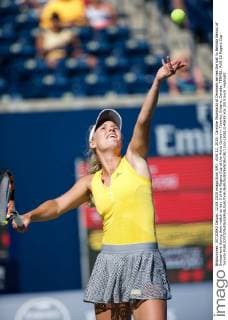 AUG 12, 2015: Caroline Wozniacki of Denmark serves the ball to Belinda Bencic of Switzerland during their match on day 3 of the Rogers Cup at the Aviva Centre in Toronto, Ontario, Canada. TENNIS: AUG 12 Rogers Cup - Toronto Icon150812140633 EDITORIAL USE ONLY