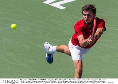 AUG 12, 2015 : Gilles Simon of France hits the ball during his match against Mikhail Youzhny of Russia in the second round of the Rogers Cup presented by National Bank at the Uniprix Stadium in Montreal, Quebec, Canada. TENNIS: AUG 12 Rogers Cup - Montreal Icon15081202 EDITORIAL USE ONLY