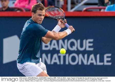 AUG 12, 2015 : Vasek Pospisil of Canada hits the ball during his match against John Isner of the United States in the second round of the Rogers Cup presented by National Bank at the Uniprix Stadium in Montreal, Quebec, Canada. TENNIS: AUG 12 Rogers Cup - Montreal Icon15081256 EDITORIAL USE ONLY