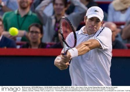 AUG 12, 2015 : John Isner of the United States hits the ball during his match against Vasek Pospisil of Canada in the second round of the Rogers Cup presented by National Bank at the Uniprix Stadium in Montreal, Quebec, Canada. TENNIS: AUG 12 Rogers Cup - Montreal Icon15081258 EDITORIAL USE ONLY