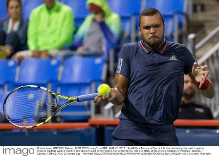 AUG 12, 2015 : Jo-Wilfried Tsonga of France hits the ball during his match against Roberto Bautista Agut of Spain in the second round of the Rogers Cup presented by National Bank at the Uniprix Stadium in Montreal, Quebec, Canada. TENNIS: AUG 12 Rogers Cup - Montreal Icon15081264 EDITORIAL USE ONLY