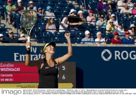 TORONTO, Aug. 12, 2015 -- Belinda Bencic of Switzerland celebrates for victory after the women s singles 2nd round match against Caroline Wozniacki of Denmark at the 2015 Rogers Cup in Toronto, Canada, on Aug. 12, 2015. Belinda Bencic won 2-0. ) (SP)CANADA-TORONTO-TENNIS-ROGERS CUP-WOMEN S SINGLES ZouxZheng 